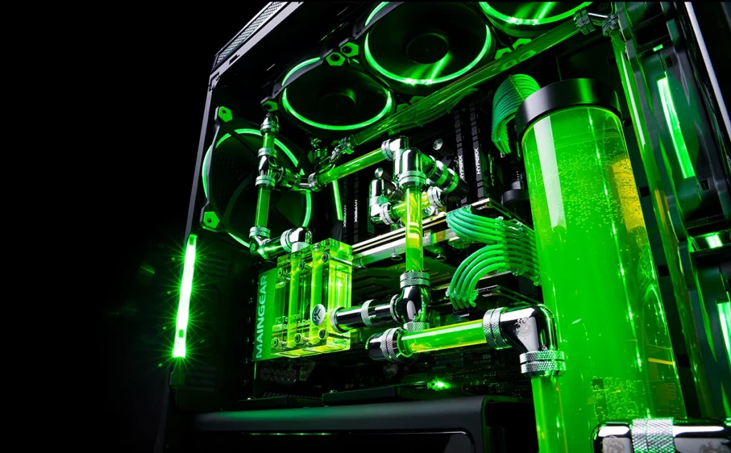 An image of a water cooling PC system setup with green tubing and lighting.