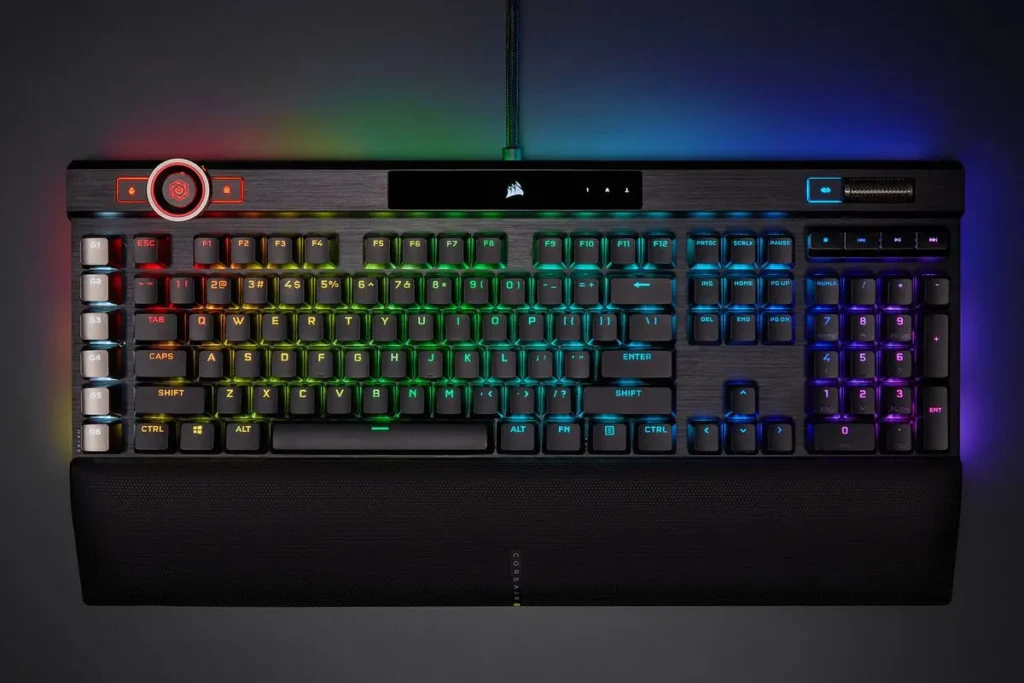 Image of the Corsair K100 RGB, a high-performance gaming keyboard with Cherry MX Speed RGB Silver switches, customizable RGB lighting, and a detachable wrist rest.